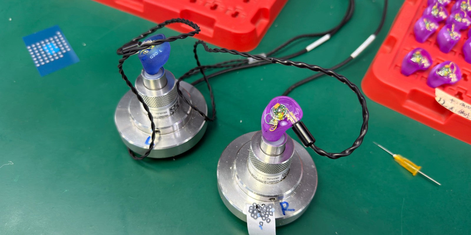 EPZ technician testing IEMs before shipping