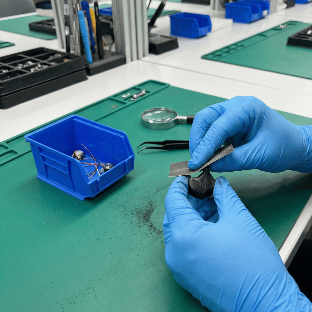 EPZ technician testing IEMs before shipping